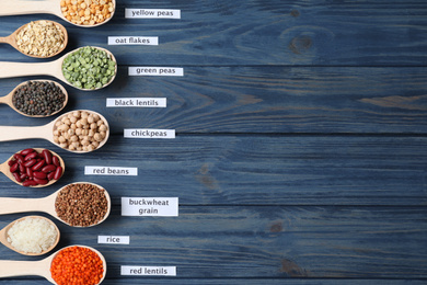 Flat lay composition with different types of legumes and cereals on blue wooden table, space for text. Organic grains