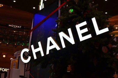 Paris, France - December 10, 2022: Chanel store with Christmas tree in shopping mall