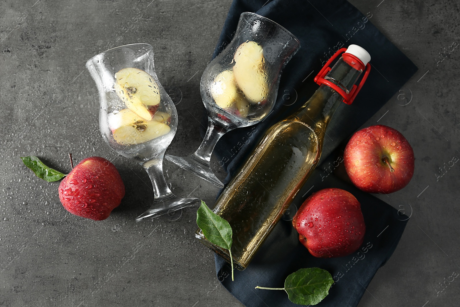 Photo of Flat lay composition with delicious apple cider on gray table