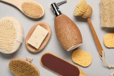Photo of Bath accessories. Flat lay composition with personal care tools on light grey background