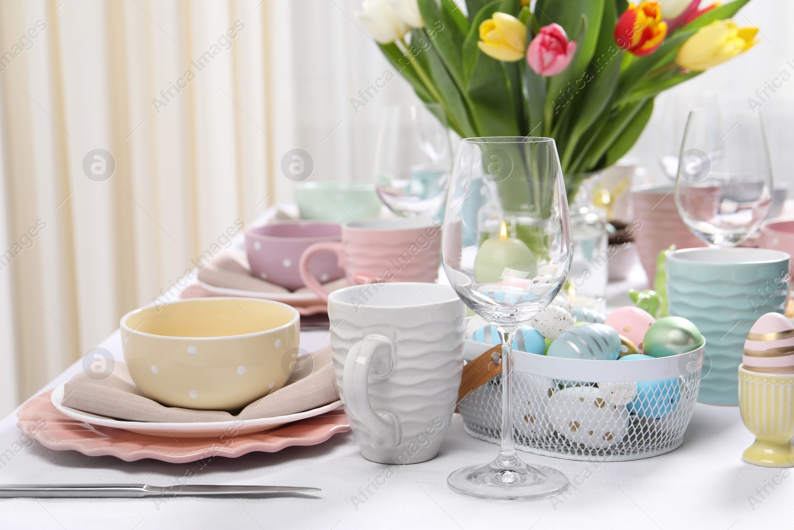 Photo of Festive table setting with beautiful flowers. Easter celebration