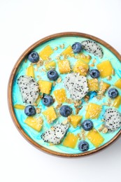 Delicious smoothie bowl with fresh fruits, blueberries and oatmeal on white background, top view