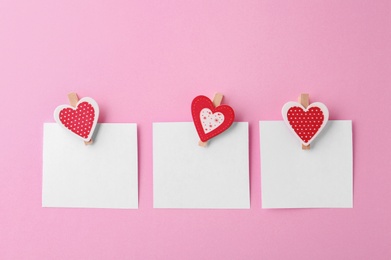 Blank paper sheets with small hearts on pink background, flat lay. Space for text