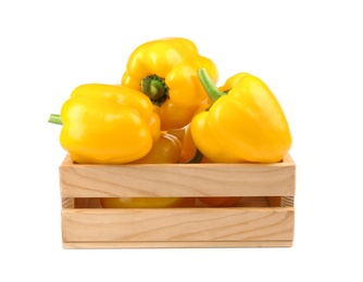 Photo of Crate of ripe yellow bell peppers isolated on white