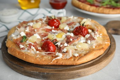 Photo of Delicious homemade pita pizza on light table, closeup