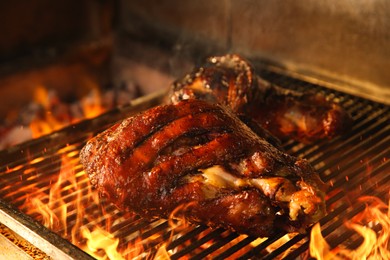 Grilling grate with pork foreshanks in oven