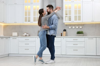 Photo of Lovely couple enjoying time together in kitchen