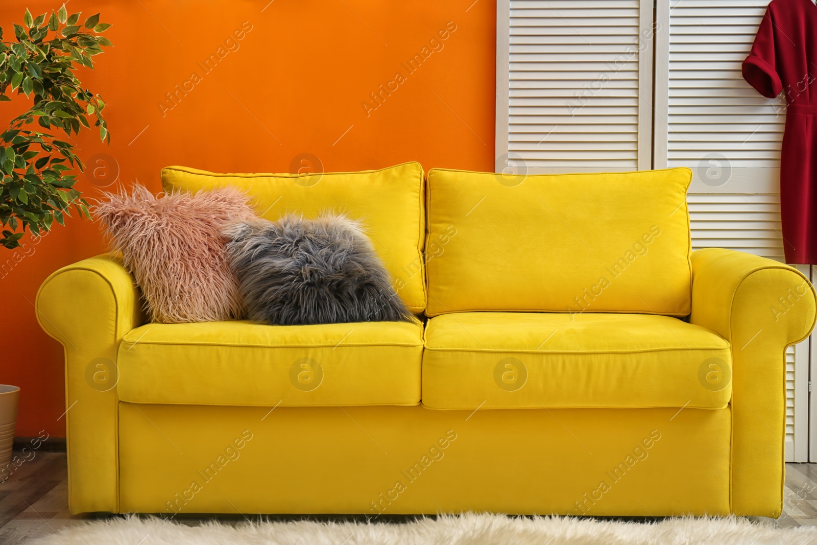 Photo of Elegant sofa with soft pillows in living room interior