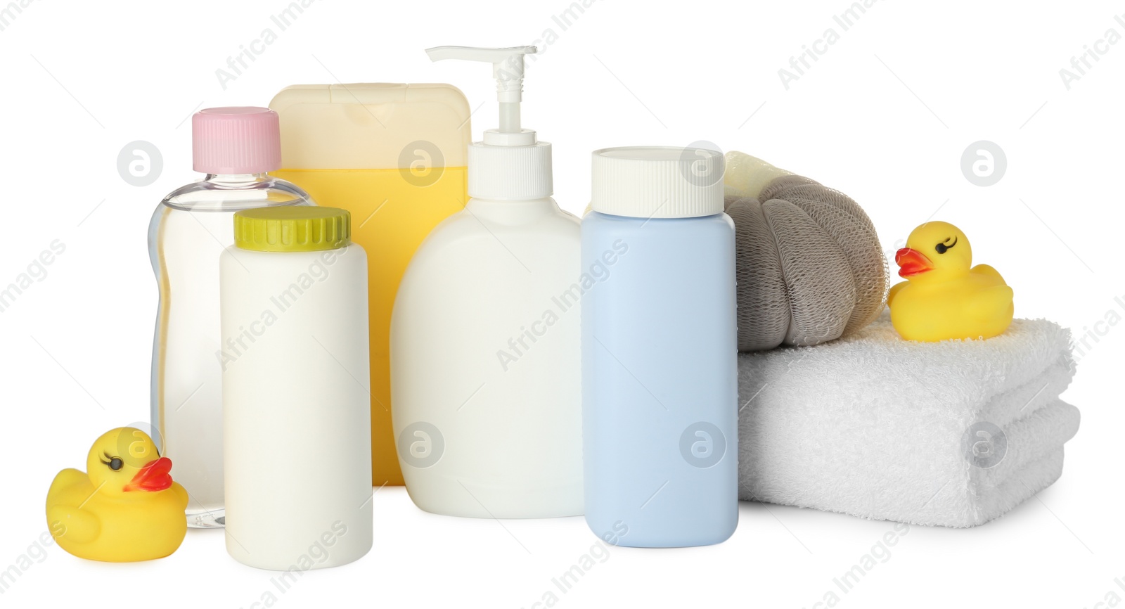 Photo of Bottles of baby cosmetic products, towel, bath sponge and rubber ducks on white background