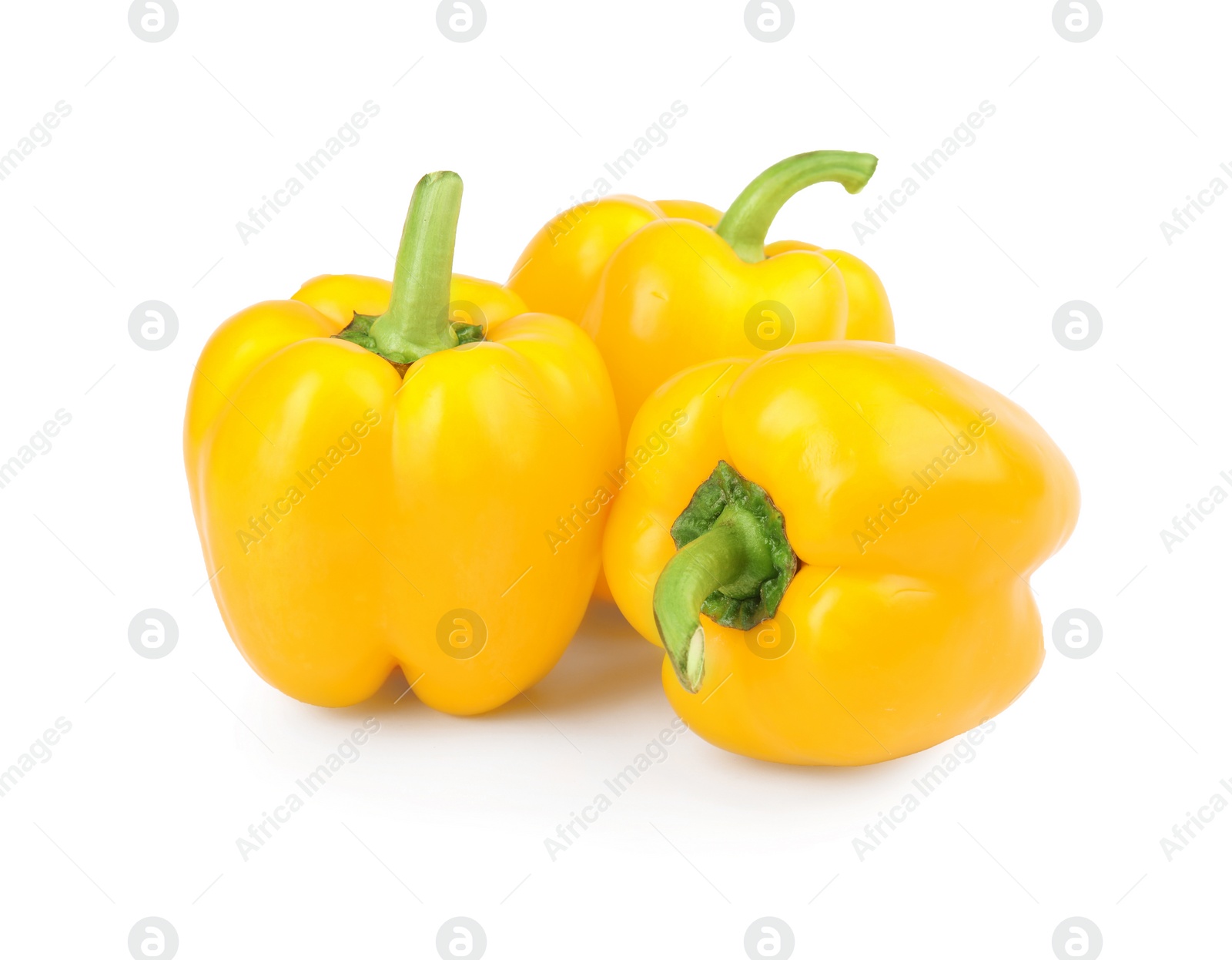 Photo of Ripe yellow bell peppers isolated on white