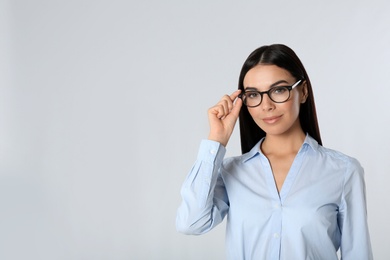 Portrait of young businesswoman on white background. Space for text