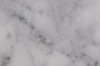 Photo of Texture of light grey marble surface as background, closeup