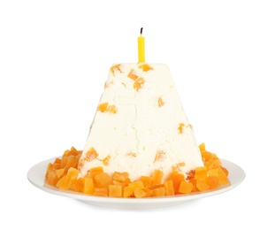 Photo of Traditional cottage cheese Easter paskha with dried apricot and candle isolated on white