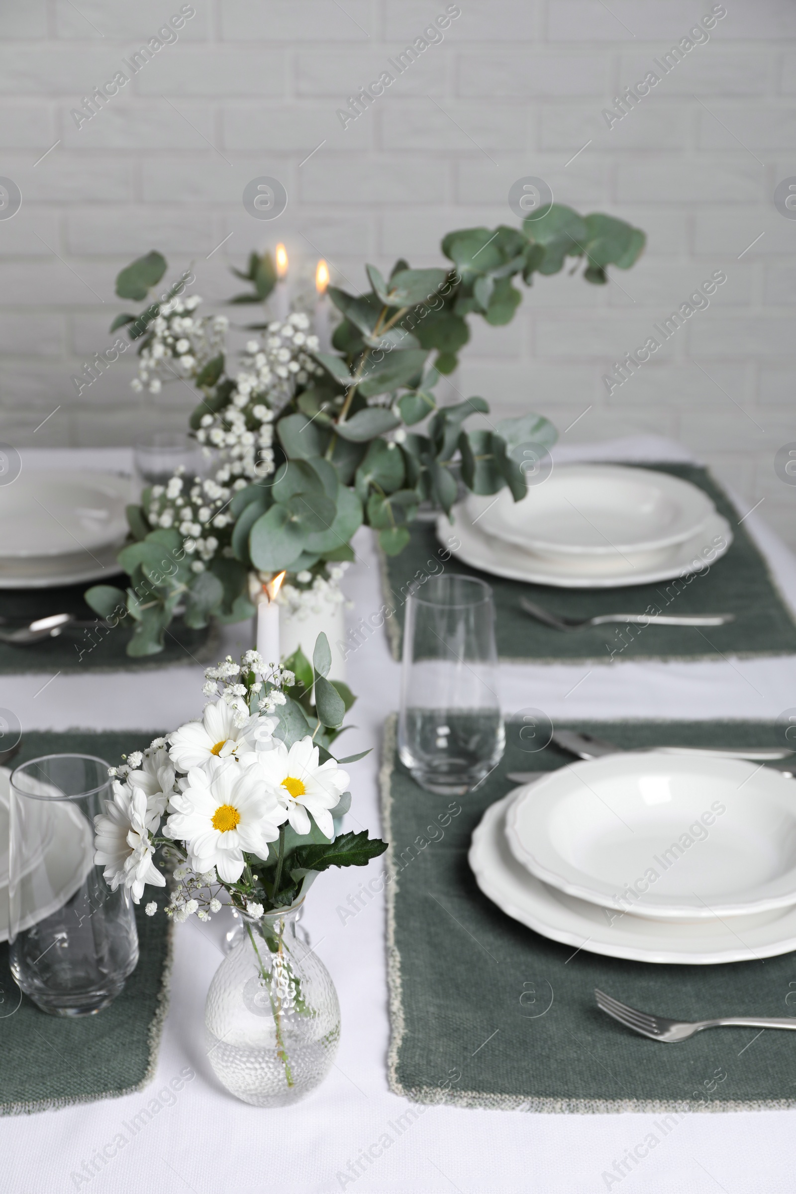 Photo of Elegant festive setting with floral decor on table