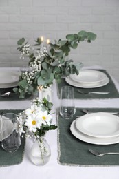 Elegant festive setting with floral decor on table