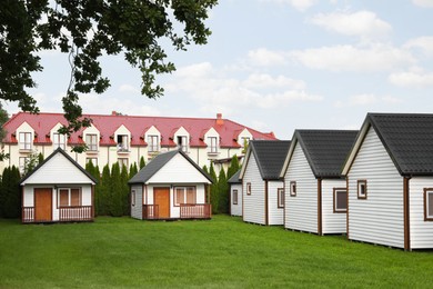 Beautiful wooden beach houses and green lawn outdoors