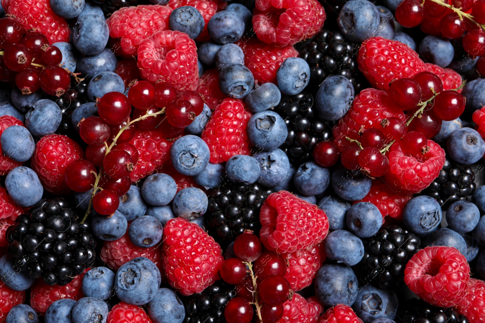 Photo of Assortment of fresh ripe berries as background, top view