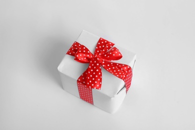 Photo of Beautifully wrapped gift box on white background