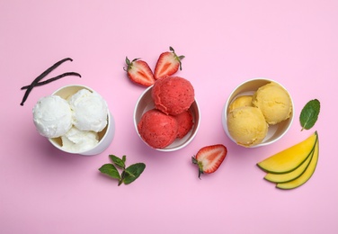 Photo of Different delicious ice creams on pink background, flat lay