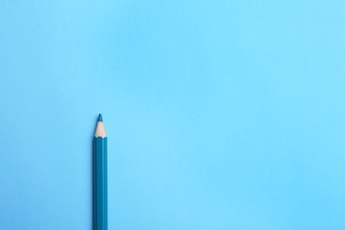 Photo of Colorful pencil on light blue background, top view. Space for text