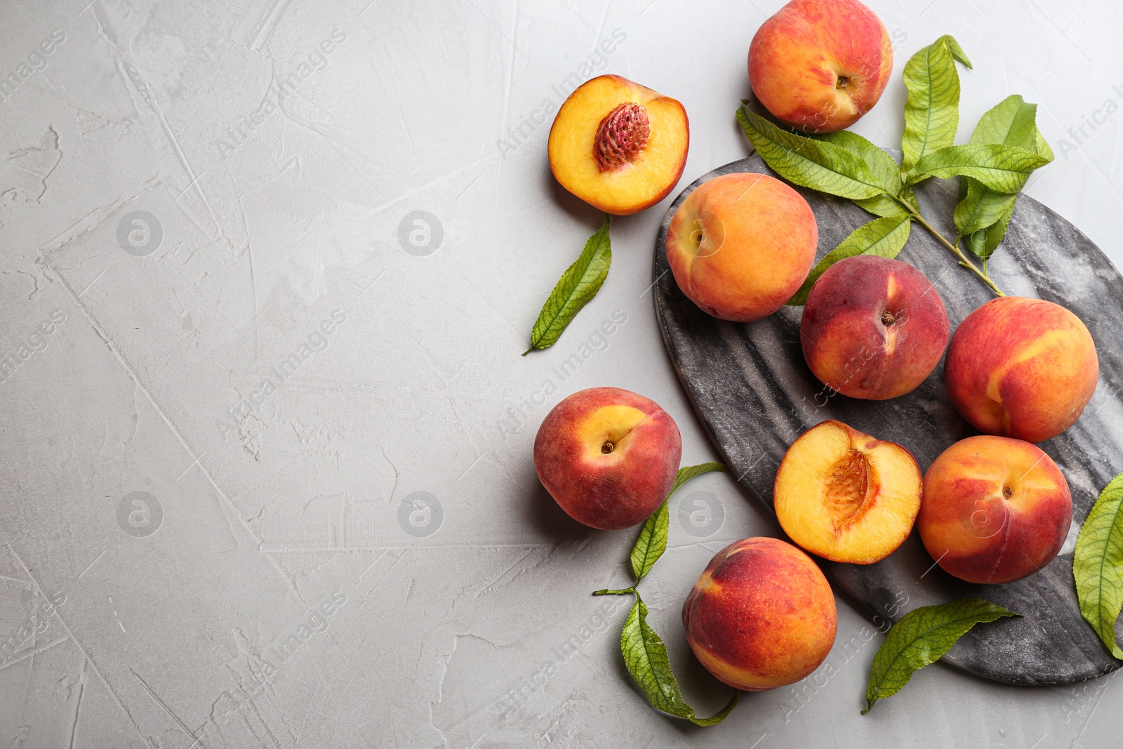 Photo of Fresh sweet peaches on light table, flat lay. Space for text