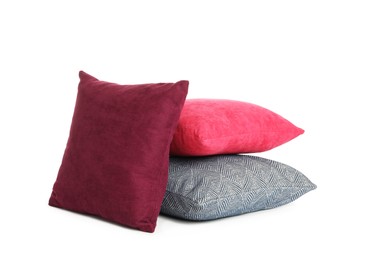 Different colorful decorative pillows on white background