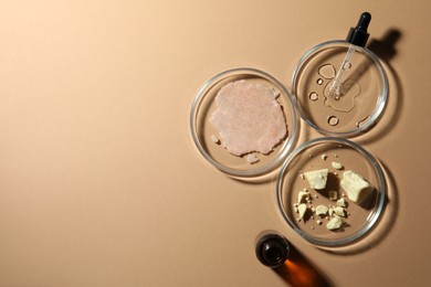 Photo of Flat lay composition with Petri dishes on beige background. Space for text