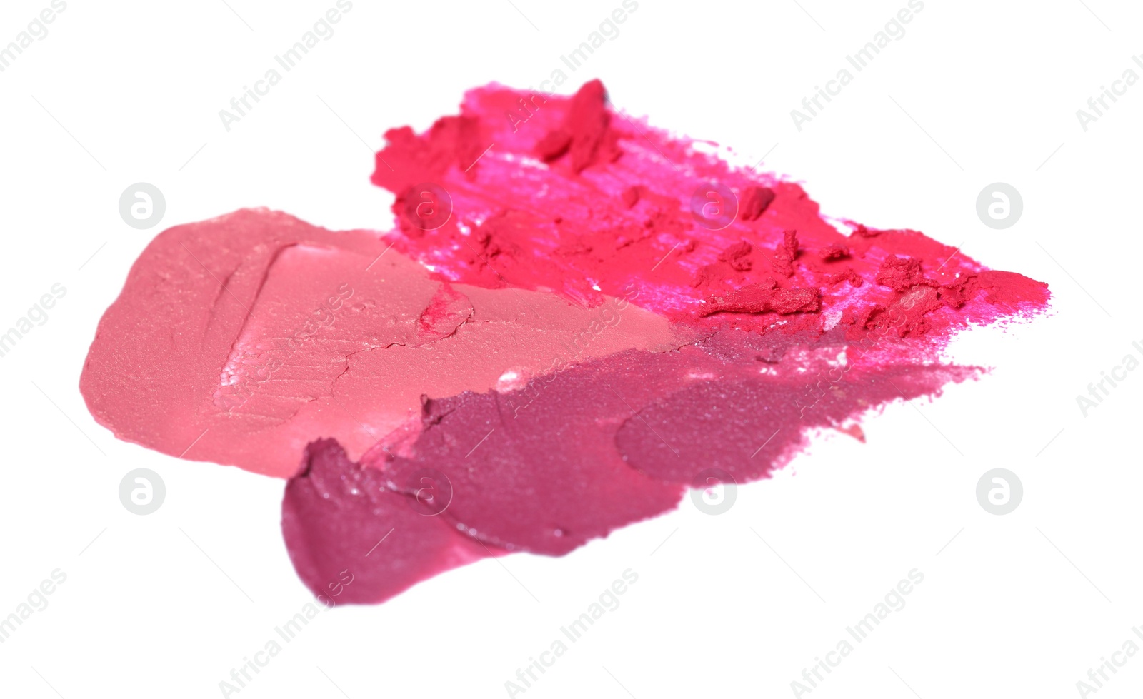 Photo of Smears of bright lipsticks on white background