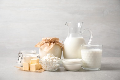 Photo of Different delicious dairy products on light table