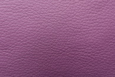 Photo of Texture of violet leather as background, closeup