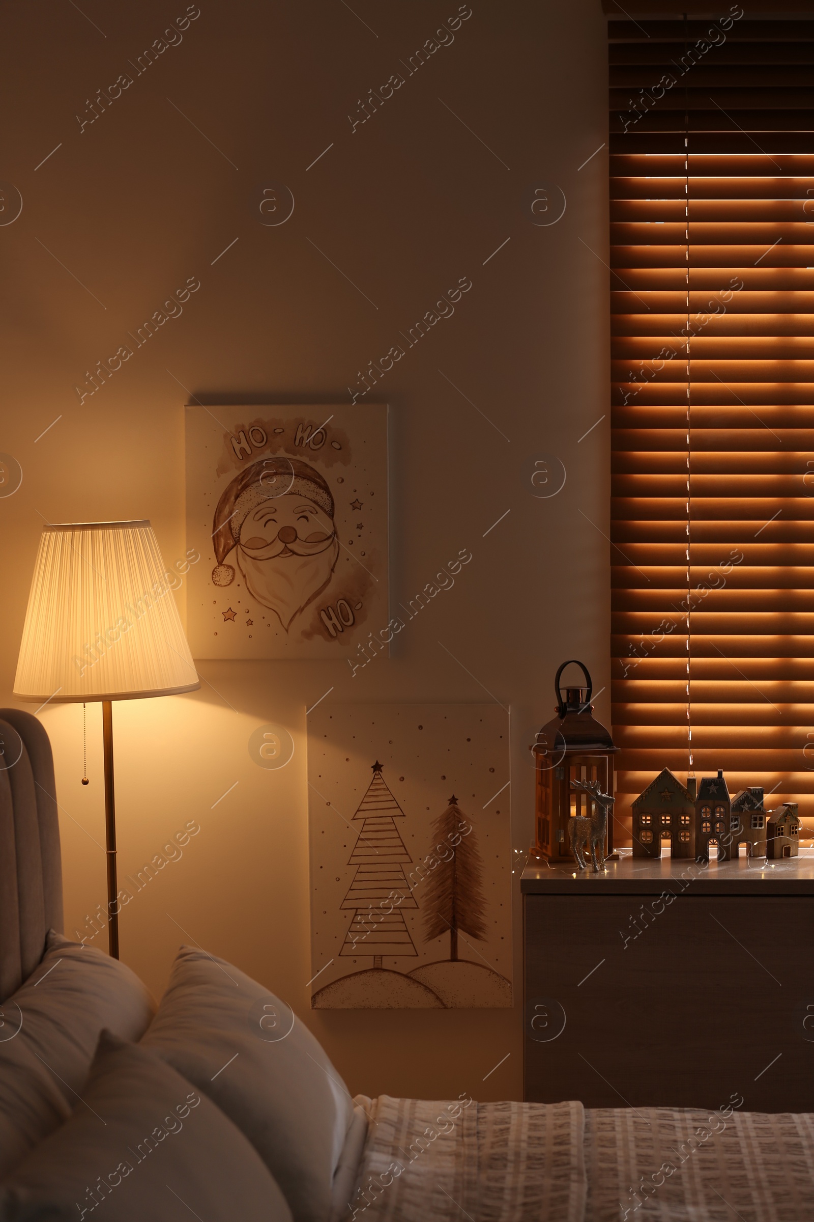 Photo of Beautiful Christmas pictures in decorated room. Interior design