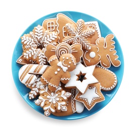 Delicious gingerbread Christmas cookies on white background, top view