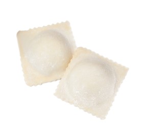 Photo of Uncooked ravioli with filling on white background, top view