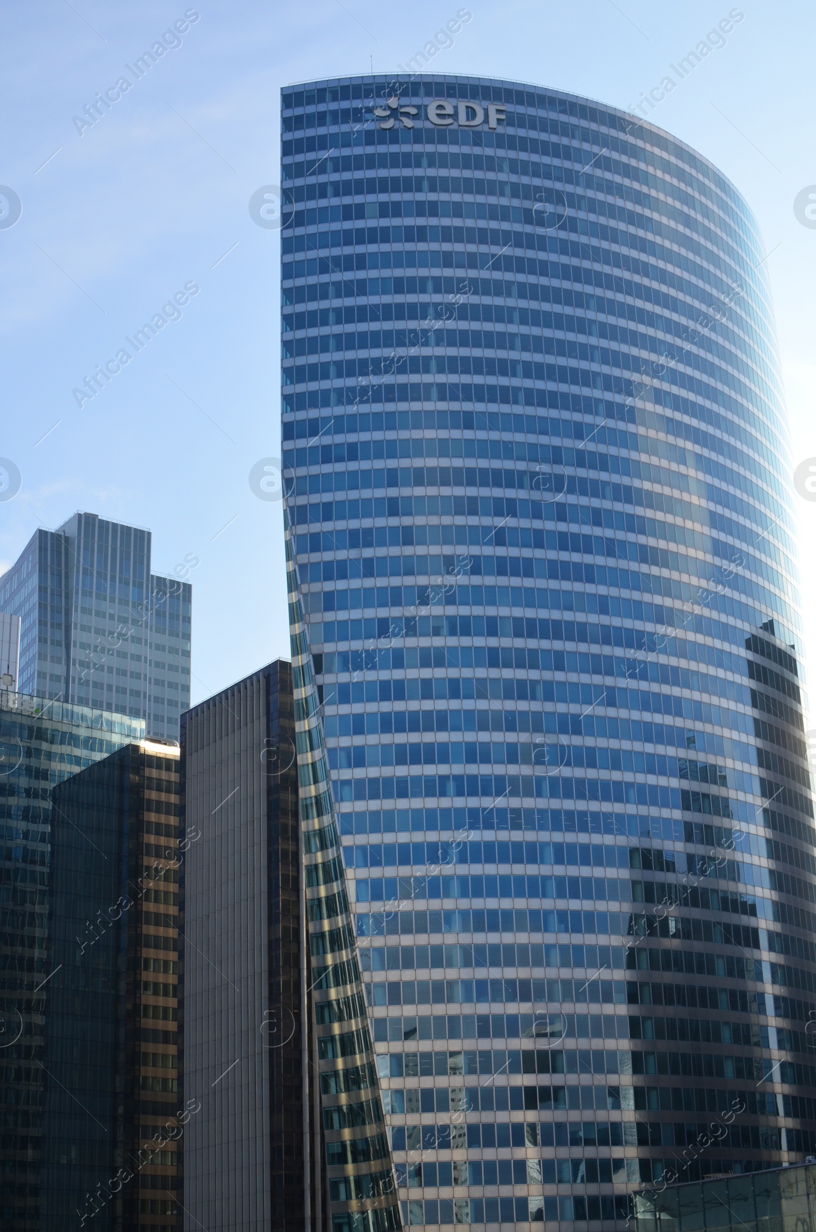 Photo of Exterior of different modern skyscrapers against blue sky