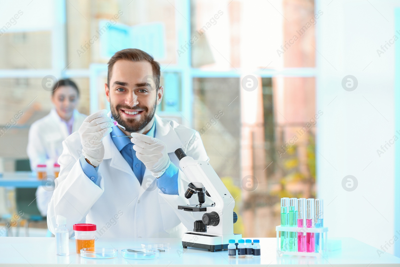 Photo of Young scientist working in laboratory, space for text. Chemical analysis