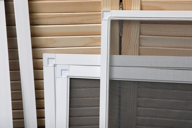 Photo of Set of window screens near wooden folding screen, closeup
