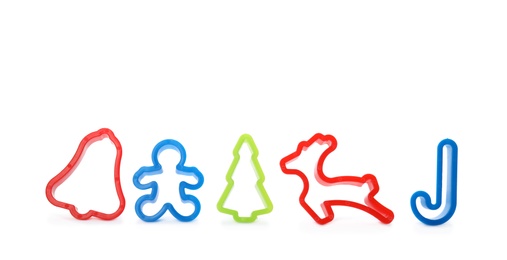 Photo of Cutters for Christmas cookies on white background