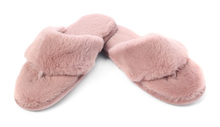 Pair of pink soft slippers isolated on white