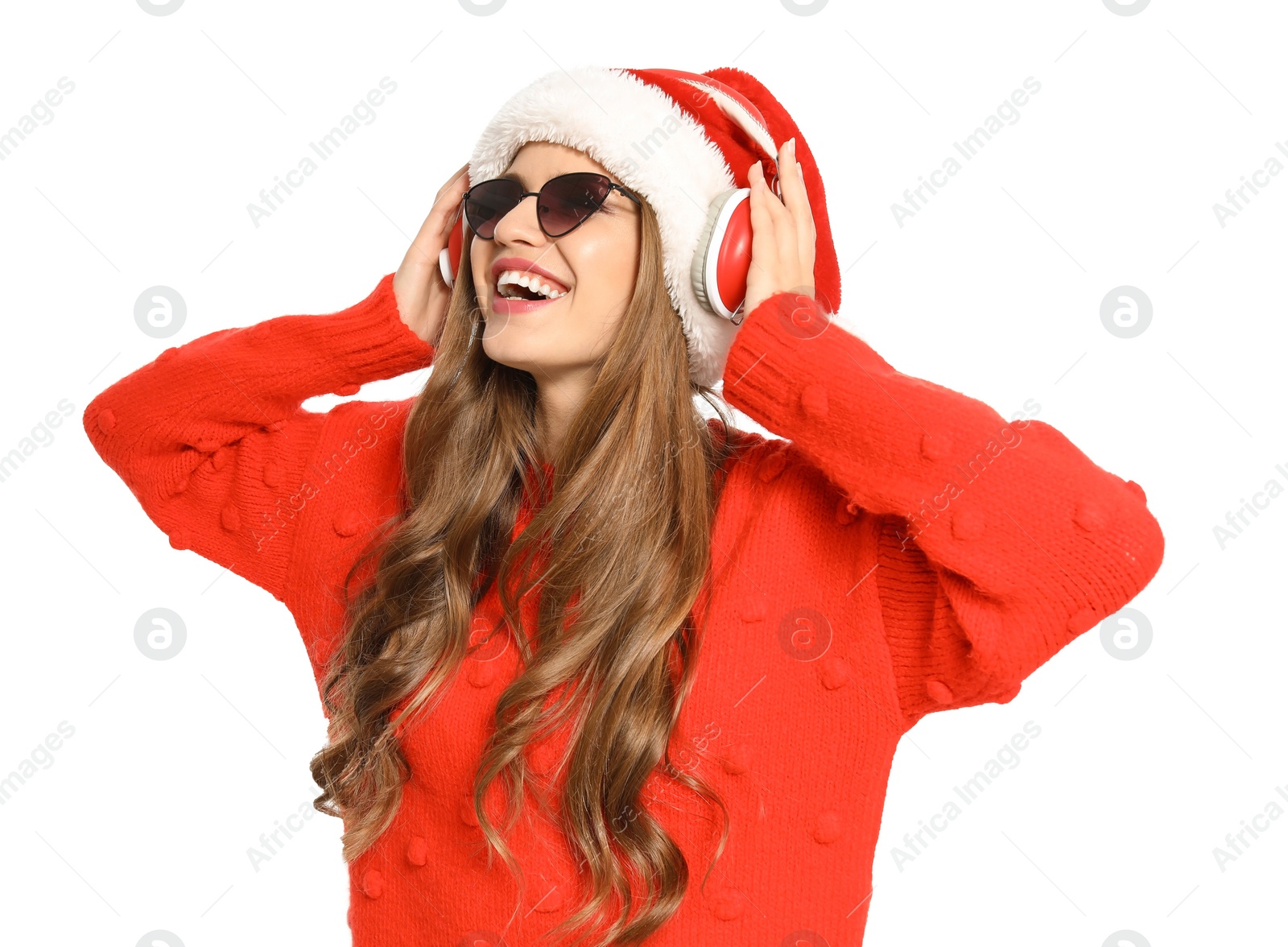 Photo of Happy young woman listening to Christmas music on white background