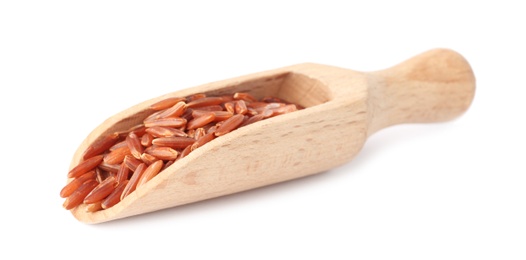 Photo of Scoop with uncooked brown rice on white background
