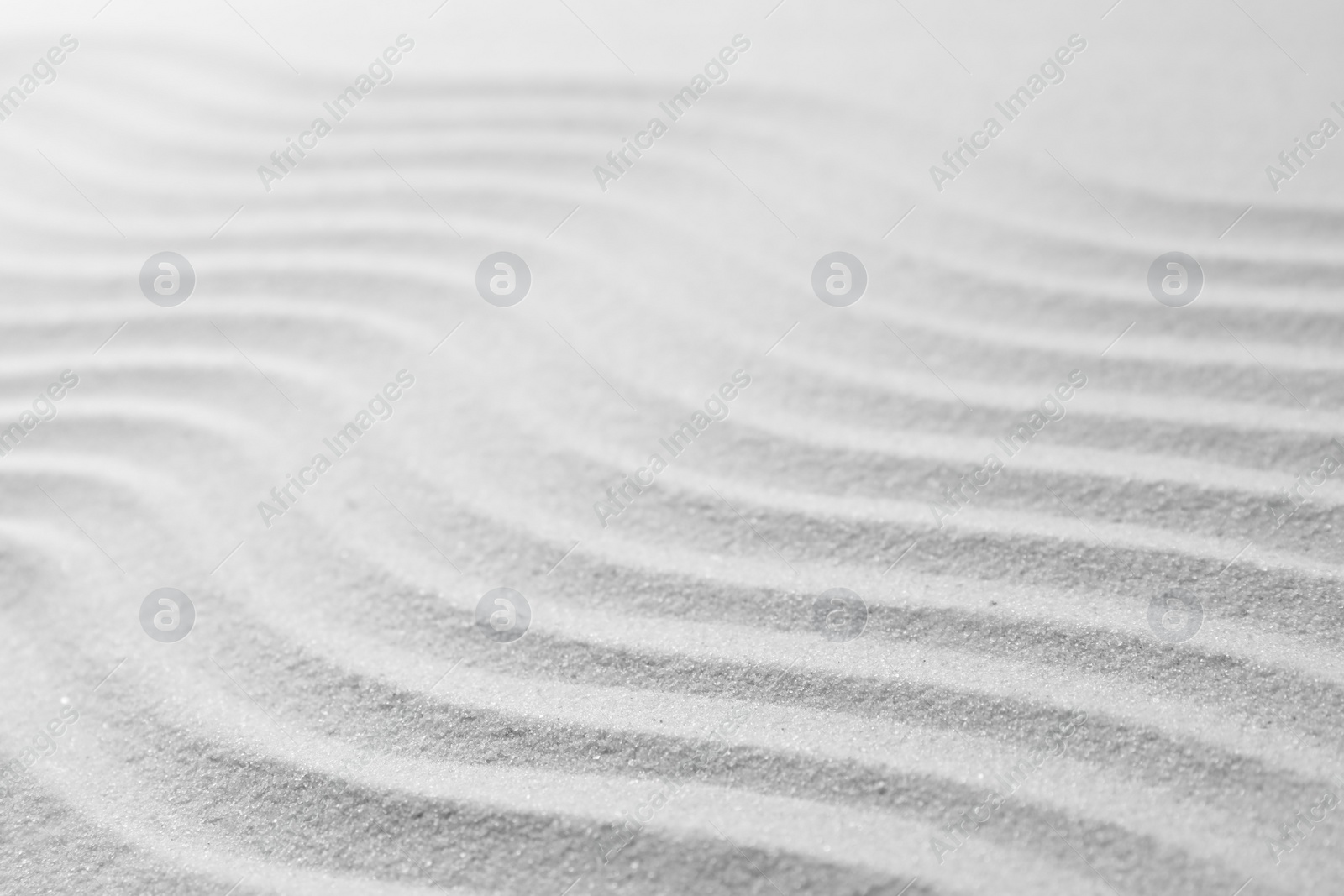 Photo of Zen garden pattern on sand. Meditation and harmony