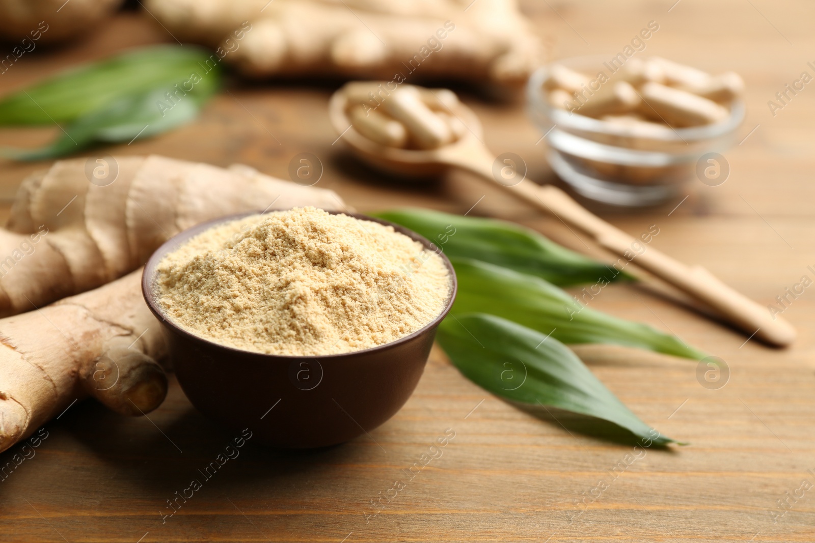 Photo of Dry and fresh ginger on wooden table
