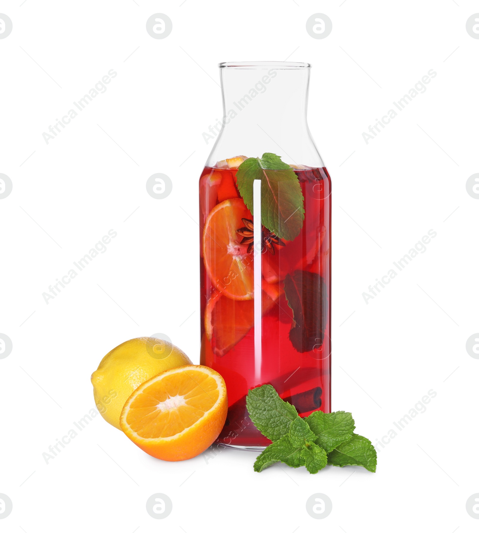 Photo of Jug with tasty punch drink and ingredients isolated on white