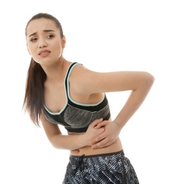 Young woman suffering from pain on white background