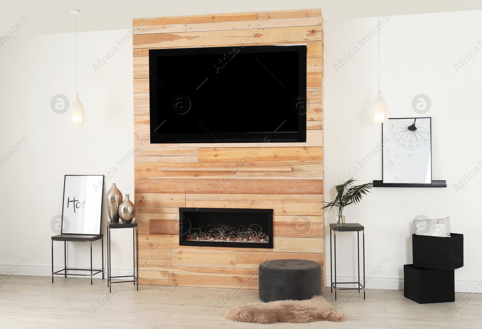 Photo of Living room interior with decorative fireplace in wooden wall