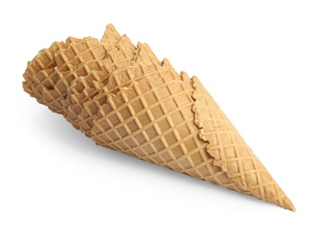 Photo of Empty wafer ice cream cones on white background