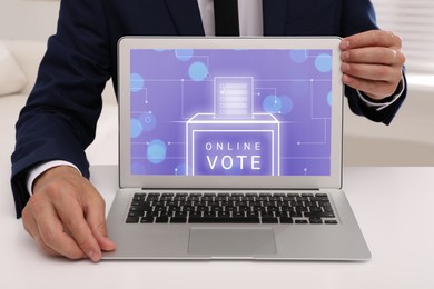 Man and laptop with app for online voting indoors, closeup
