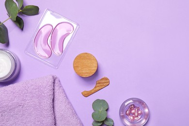Flat lay composition with skin care products on violet background, space for text