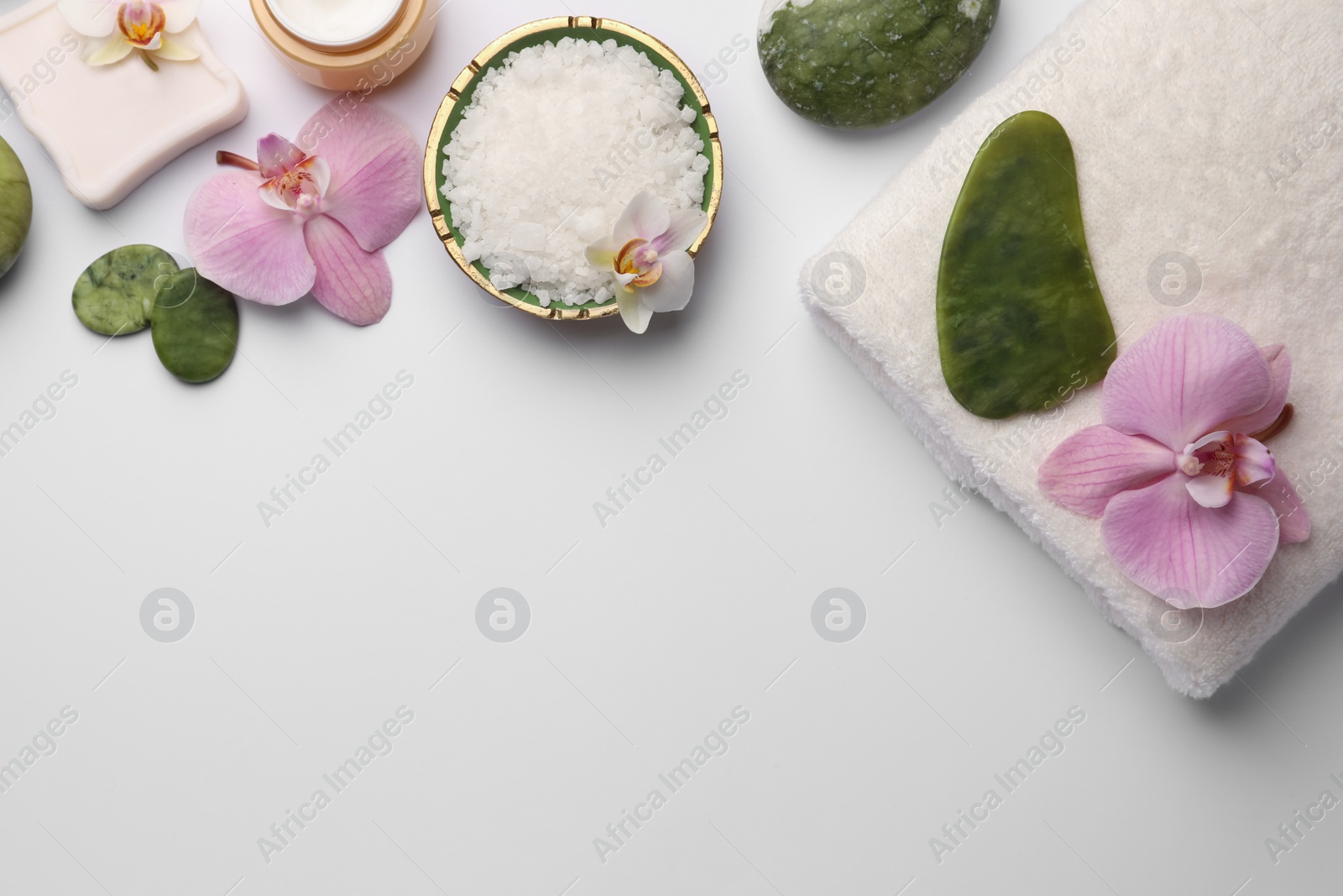 Photo of Flat lay composition with different spa products on white background. Space for text