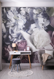 Beautiful room interior with stylish furniture and floral pattern on wall